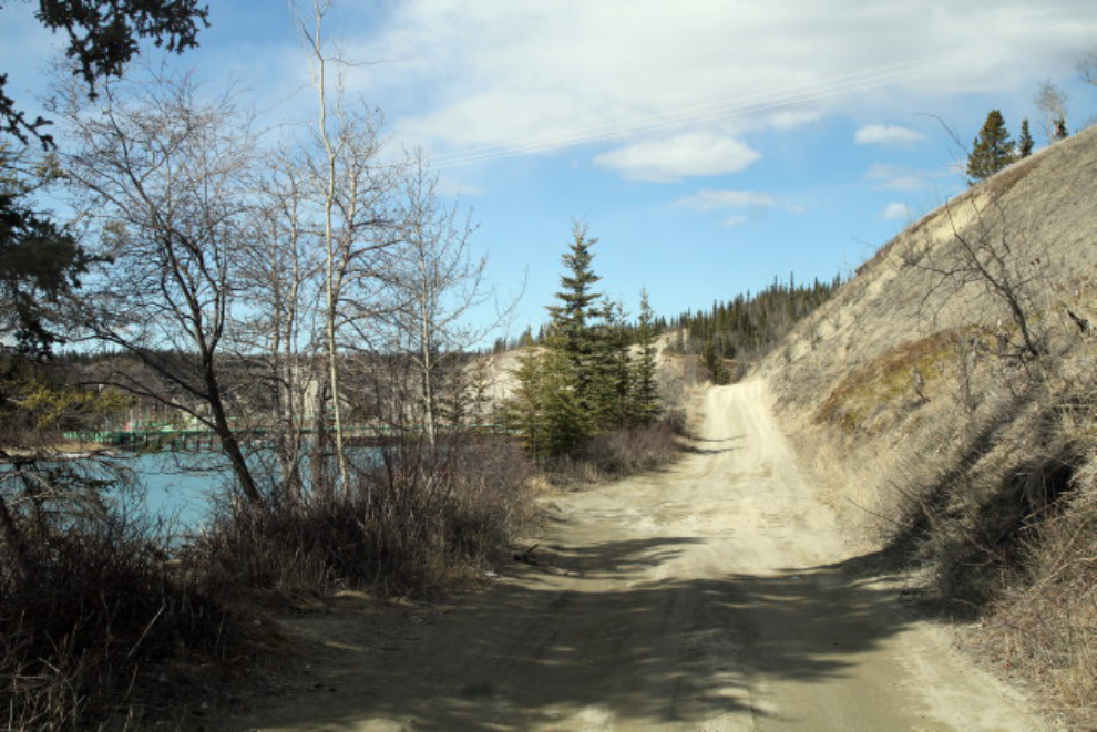 The rough dirt road leading to the Lewes River Dam near Whitehorse