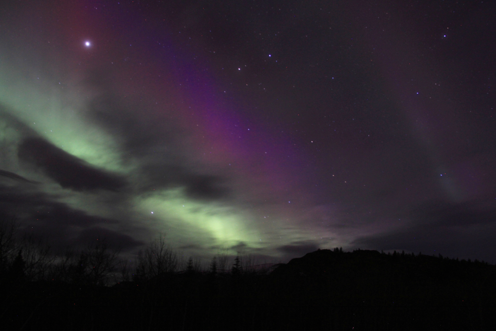 The aurora borealis over the Alaska Highway in the Yukon