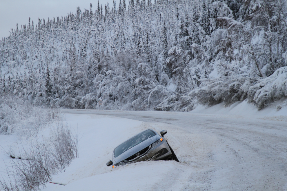 Car off in a snowbank along the North Klondike Highway