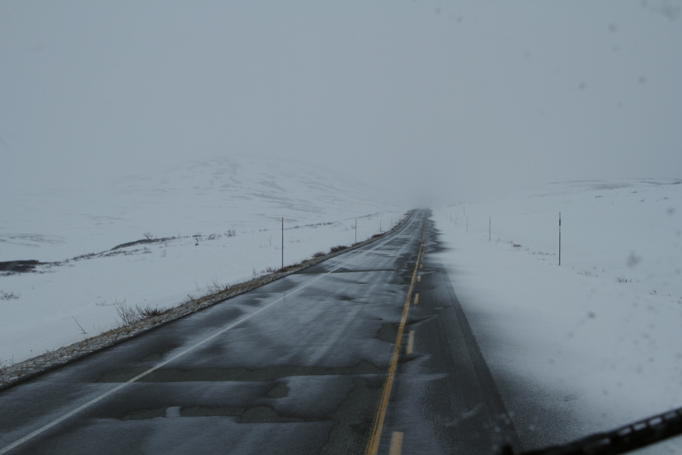 Snow drifting across the Haines Highway in April