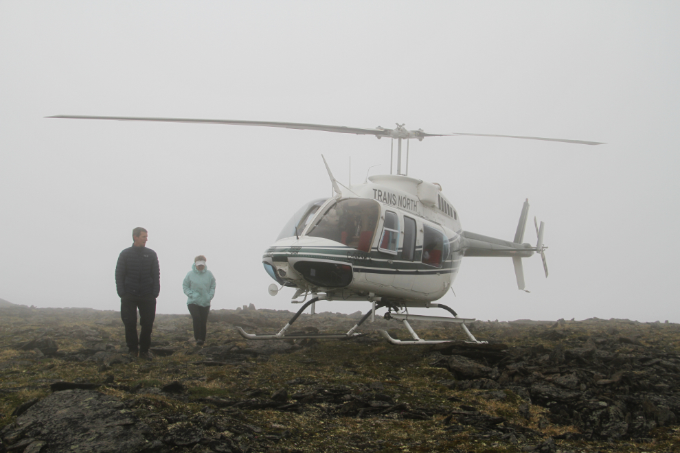 Helicopter on a mountain-top in thick cloud