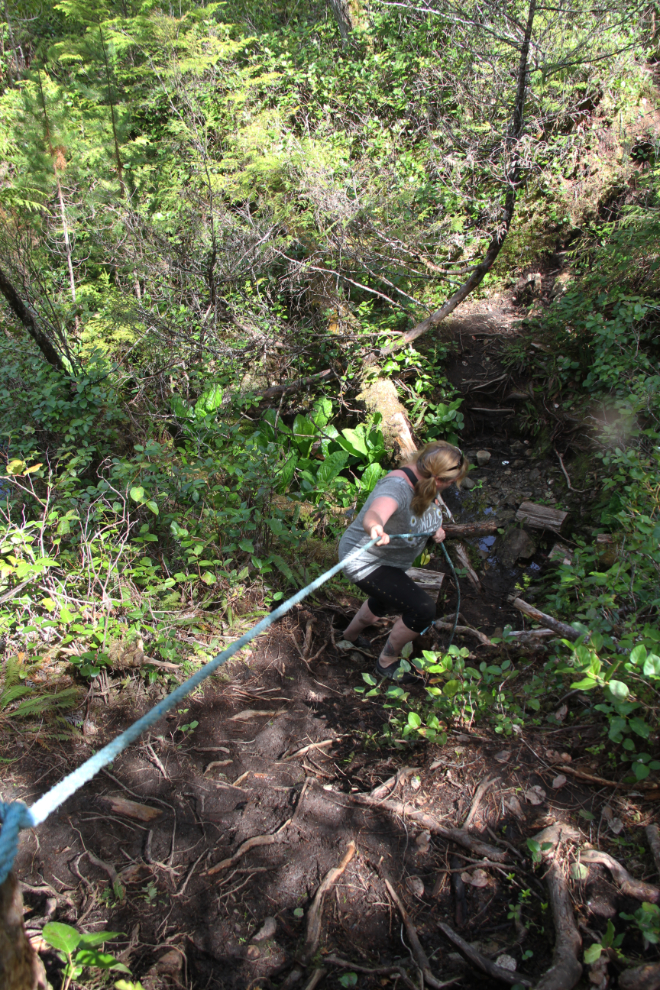 Rope assist. Hiking to the crash site of RAF 'Dakota 576' near Port Hardy, BC