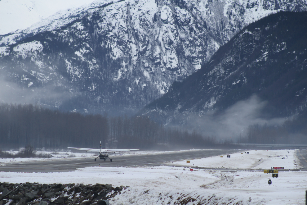 Cessna Caravan taking off from Skagway on a snowy March day