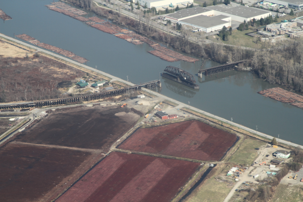 Aerial view of a railway bridge over the Fraser River at Burnaby