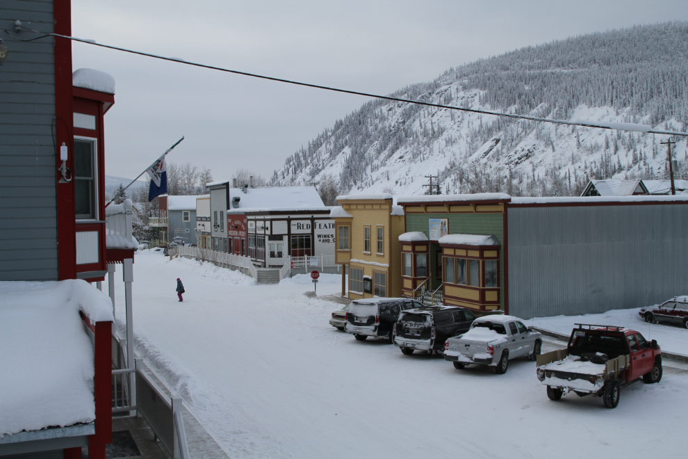 The view from the upper level of the Eldorado Hotel annex, looking down Third Avenue to the Red Feather Saloon and beyond, Dawson City