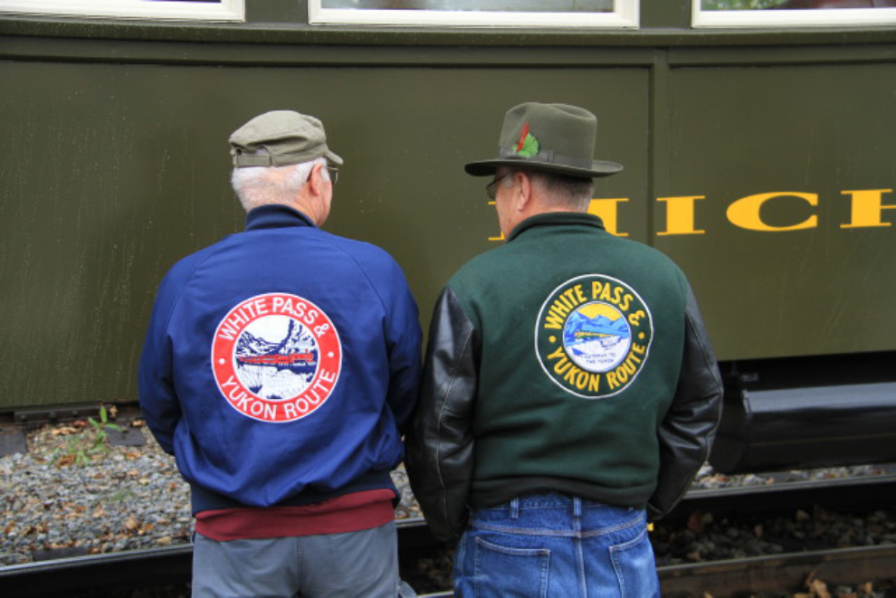 Retired Whitepassers Carl Mulvihill and John McDermott model the old and the new of White Pass jackets