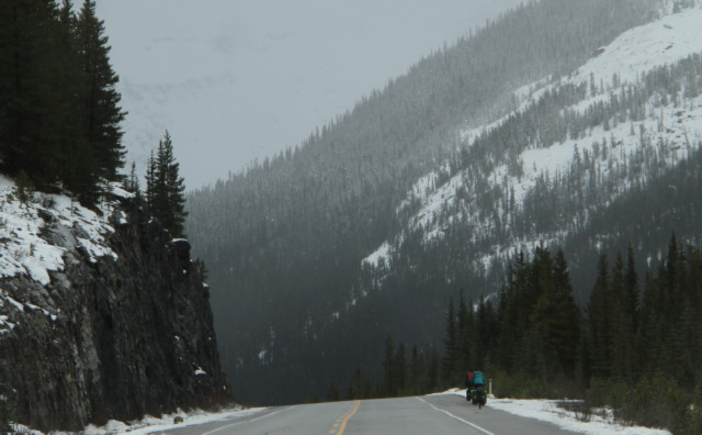 Bicyclists on the Icefields Parkway in early winter
