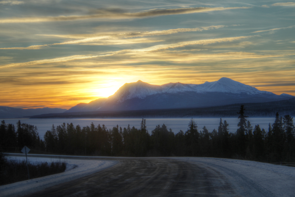 The sun coming up over the Dawson Peaks and Teslin Lake on the Alaska Highway