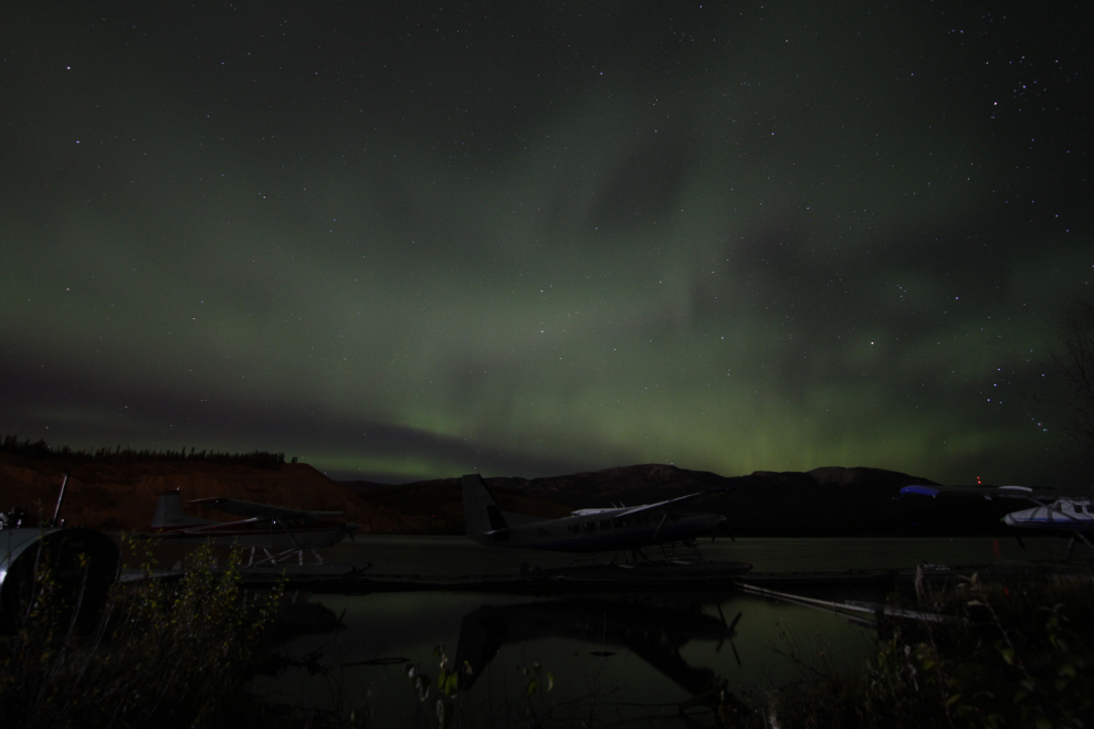 Aurora borealis with float planes at Schwatka Lake, Yukon