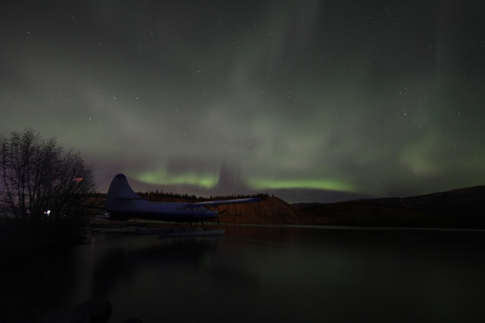 Aurora borealis with a Turbo Otter float plane at Schwatka Lake, Yukon