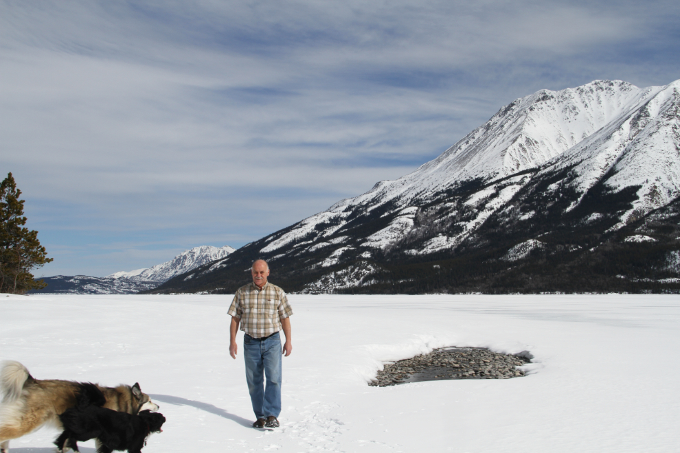 Murray Lundberg and his dogs on frozen Tutshi Lake, BC