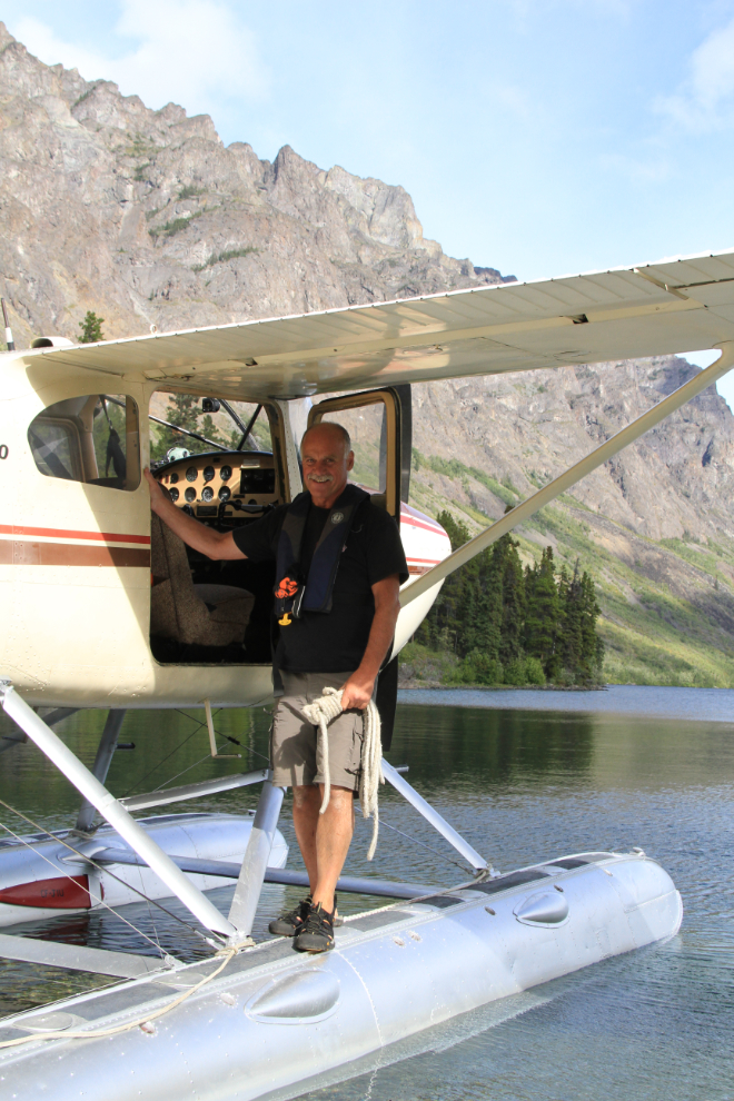 Murray Lundberg on the float of a bush plane on a remote beach on Tutshi Lake, BC