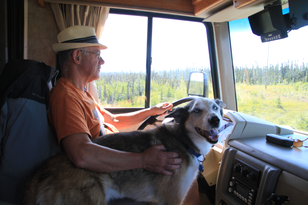 Murray and his old husky Monty driving the RV through Alaska