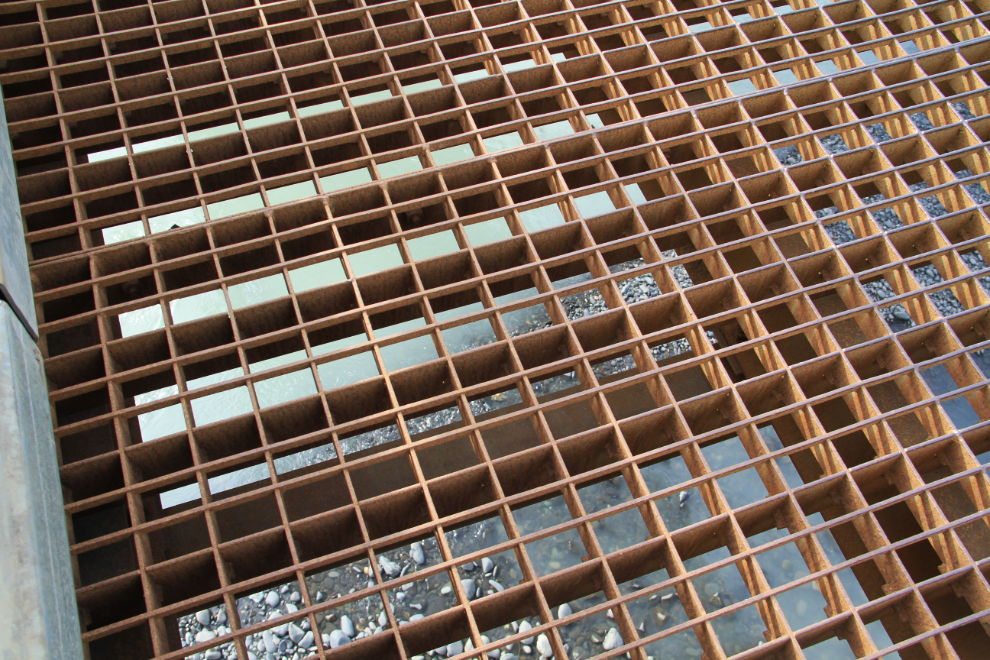 The metal grate deck of the bridge across the Bell-Irving River