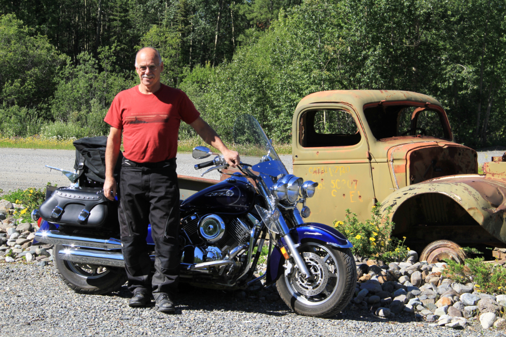 Murray Lundberg with his motorcycle at the Canol Road rest area, Alaska Highway