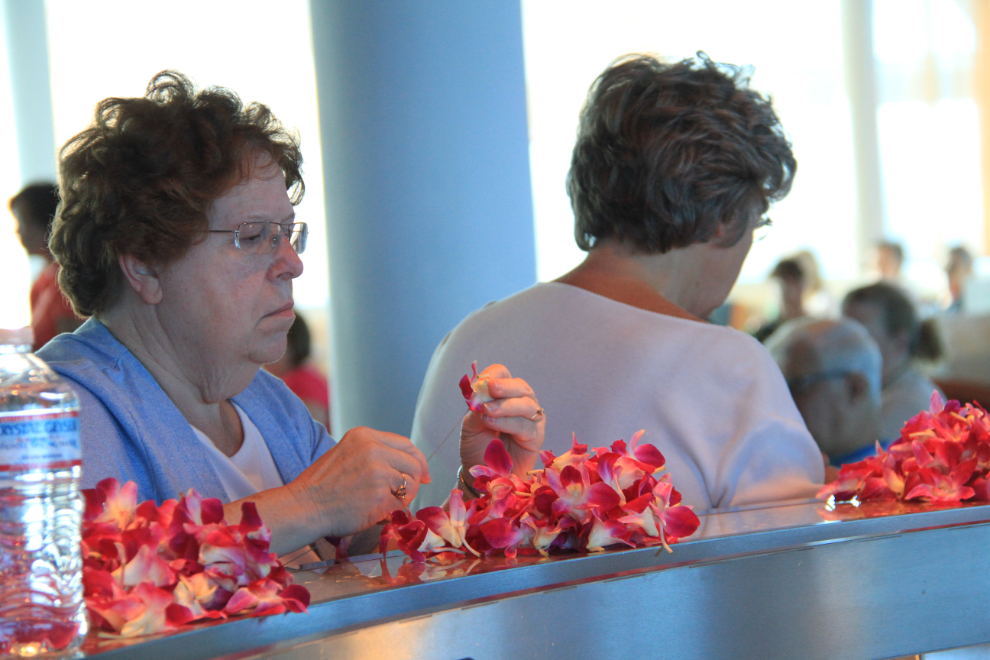Making leis on the cruise ship Celebrity Solstice
