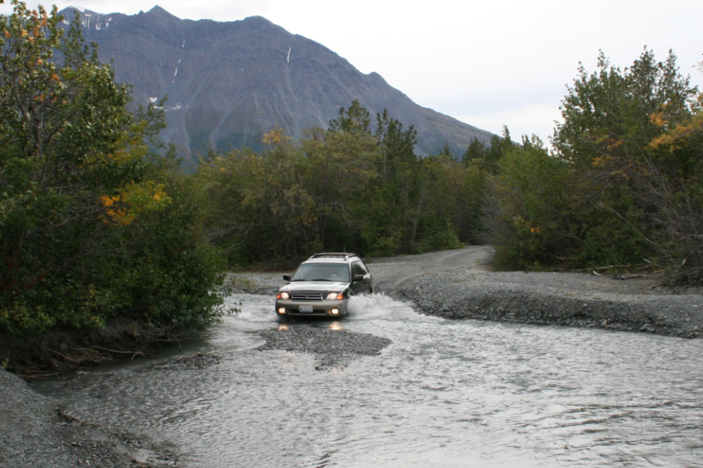 Subaru Outback crossing a creek in Kluane