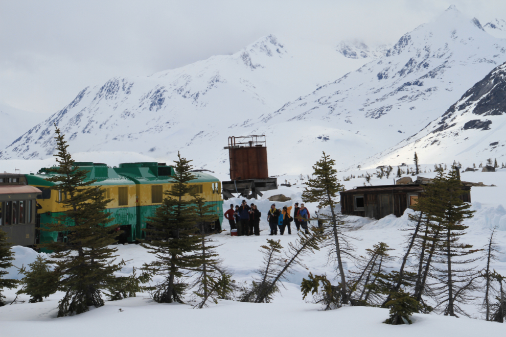 Snowshoers meet a train in the White Pass