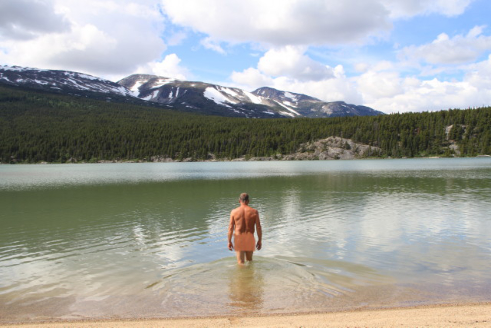 Going for a dip in the chilly waters of Lindeman Lake, B