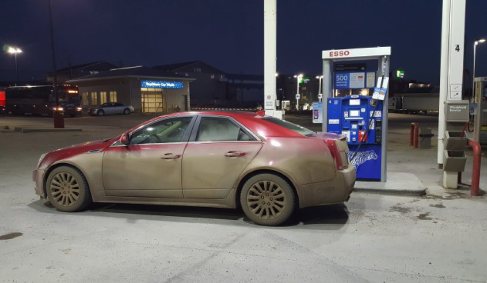 Fueling up my very dirty Cadillac CTS