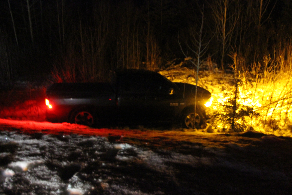 A truck off the road east of Teslin