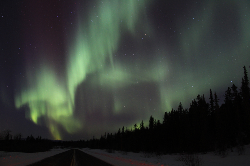 The aurora borealis over the Alaska Highway in the Yukon