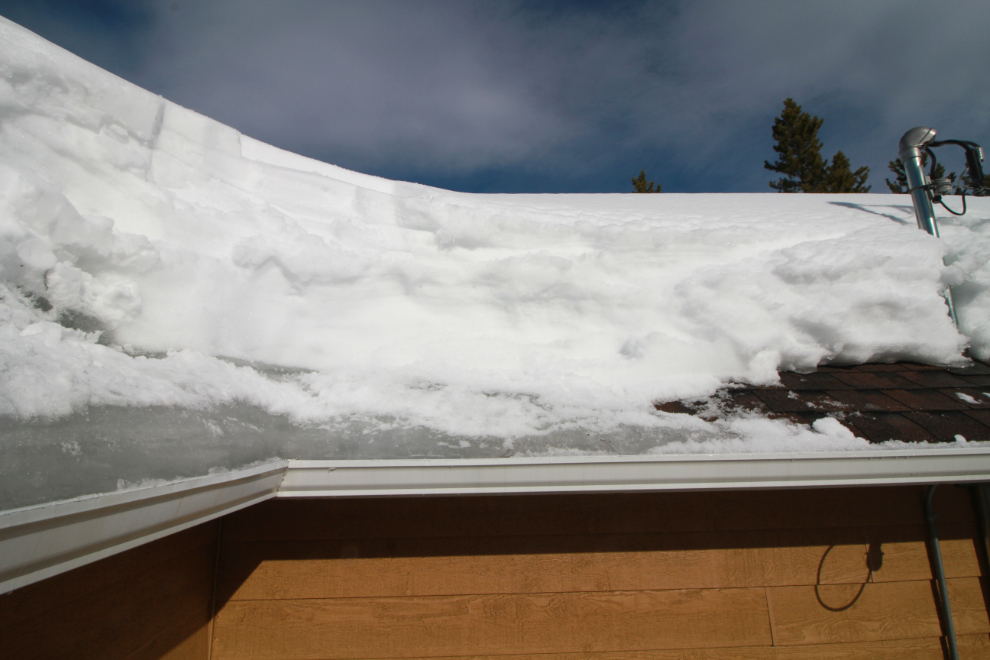 Deep ice buildup on the edge of my roof