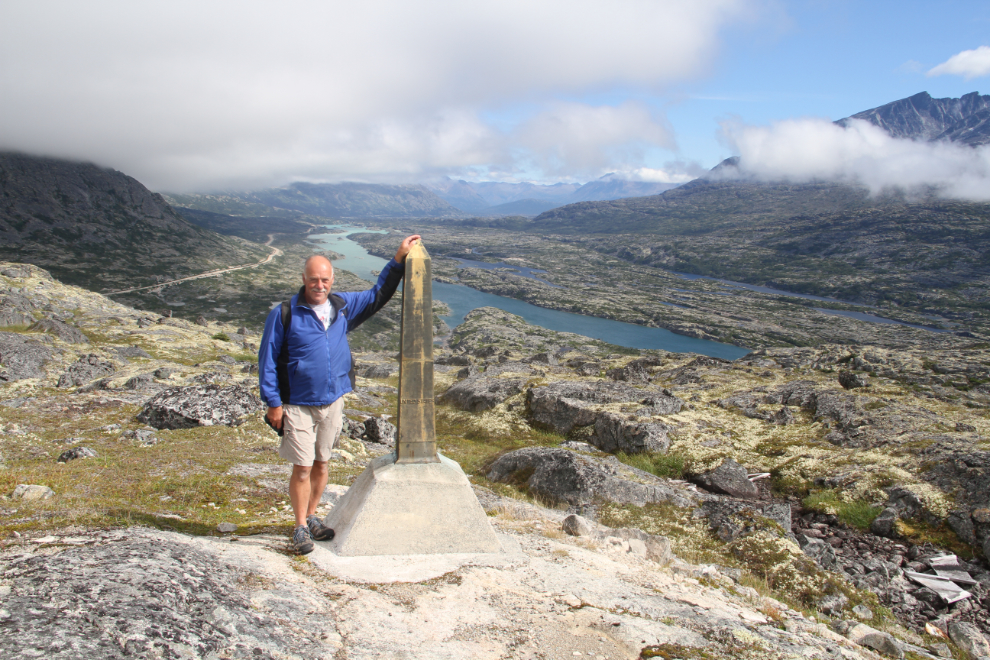 Murray Lundberg at a Canadas/USA border monument in the White Pass