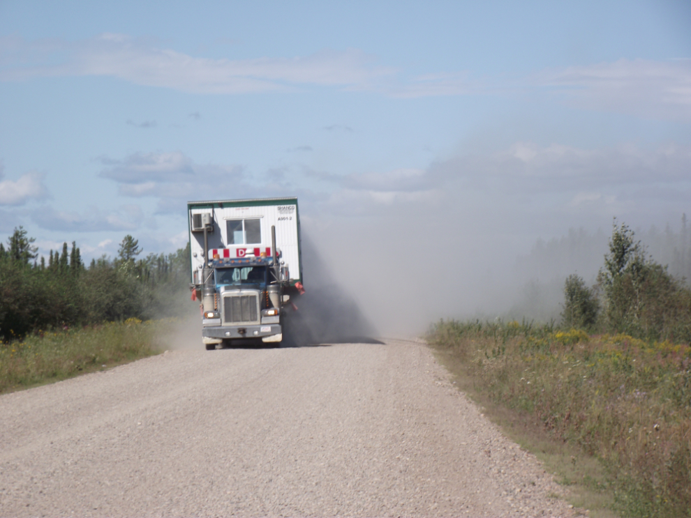 A semi on the gravel Liard Highway raises a LOT of dust!