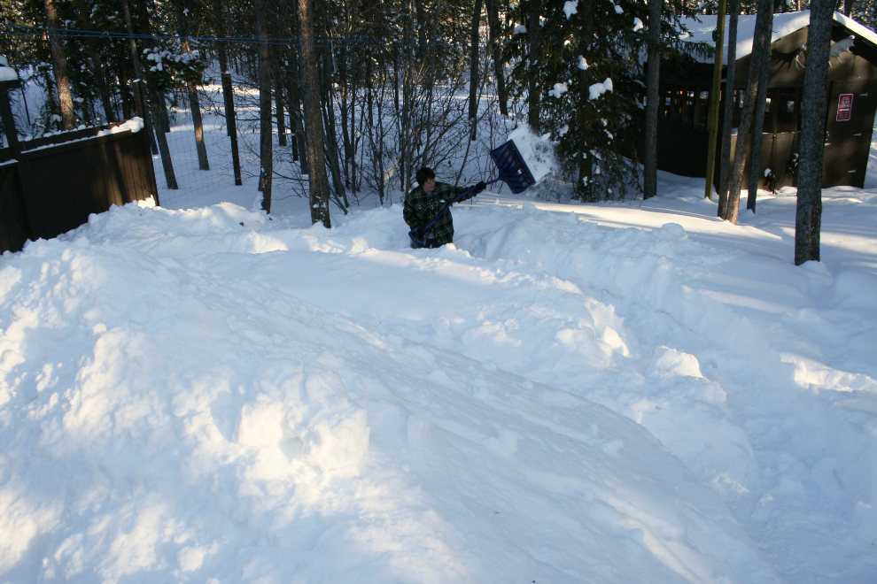 Cathy battling deep snow with a shovel