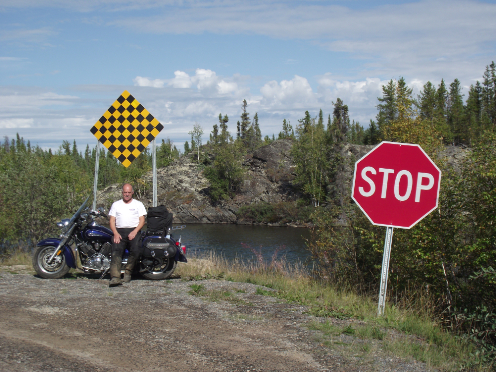 Murray Lundberg with his motorcycle at the end of NWT Highway 4, the Ingraham Trail