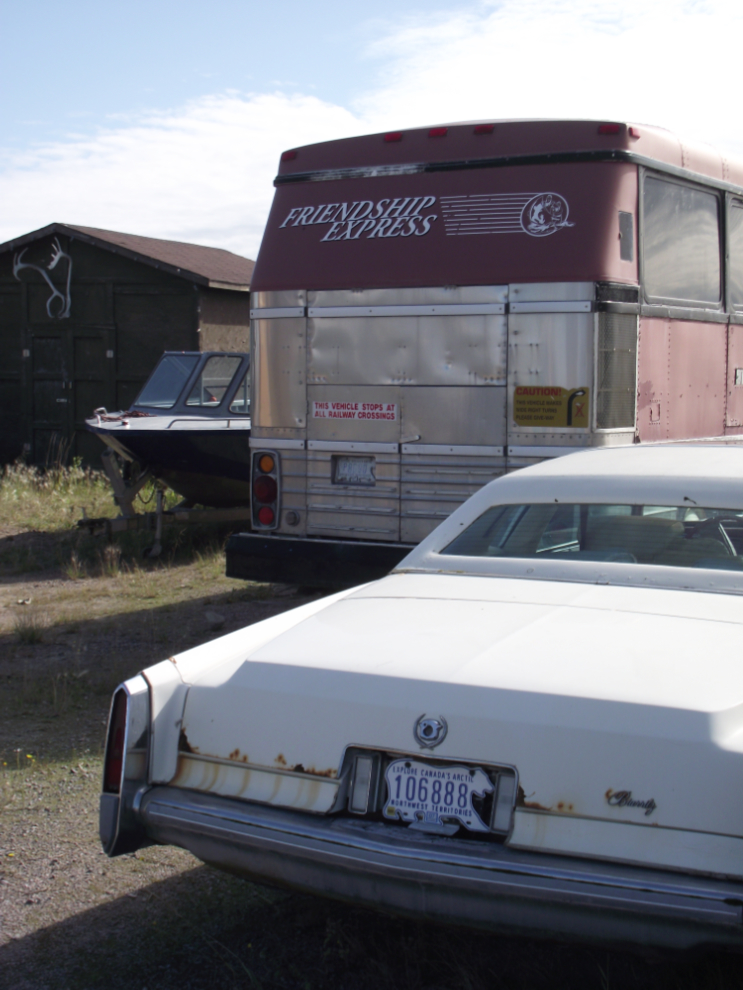A bus and Cadillac in Rae, NWT