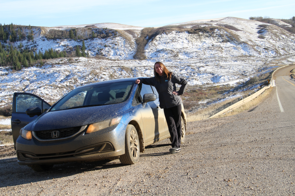Andrea and her Honda Civic after a lot of muddy Alberta road