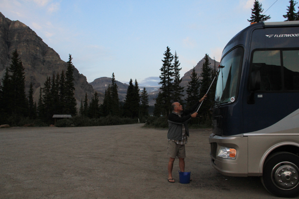 Washing the motorhome window along the Icefields Parkway, Alberta