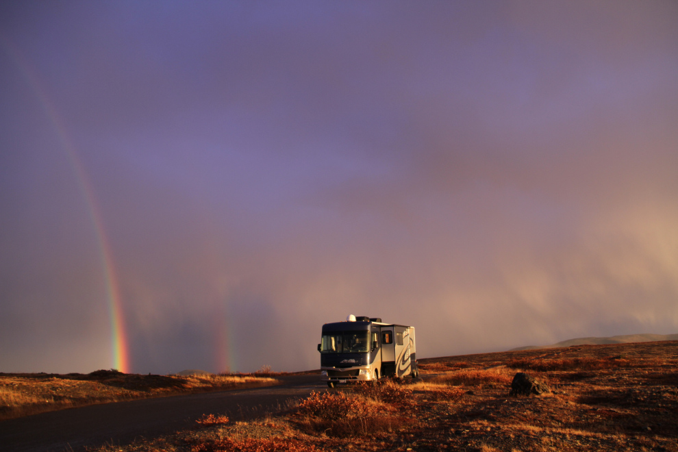 RV and Fall rainbow at the summit of the Top of the World Highway, Yukon