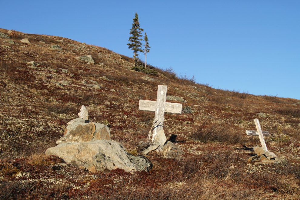 Grave of W.E. McMillan above an old mining road on the Top of the World Highway, Yukon