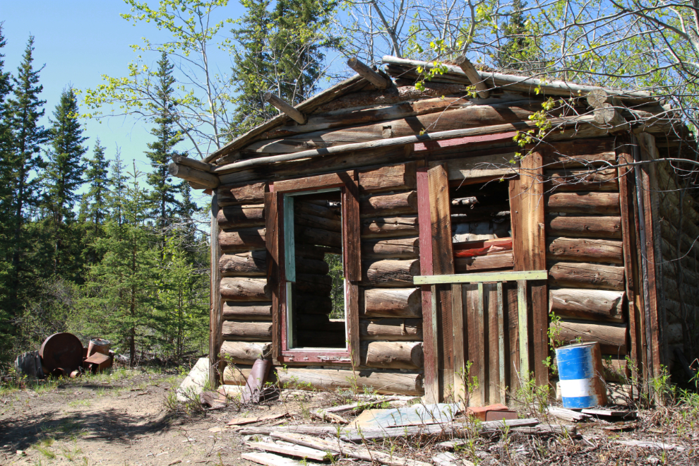 A historic log cabin along The Great Trail flooded at Dugdale Creek, Yukon