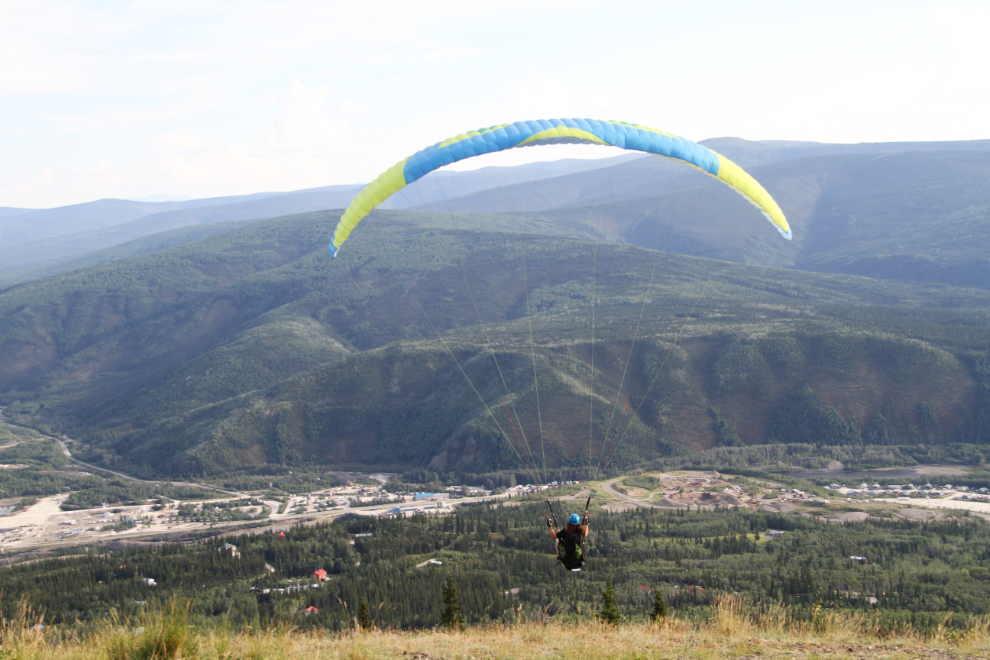 Hang glider launches from from the Midnight Dome at Dawson City
