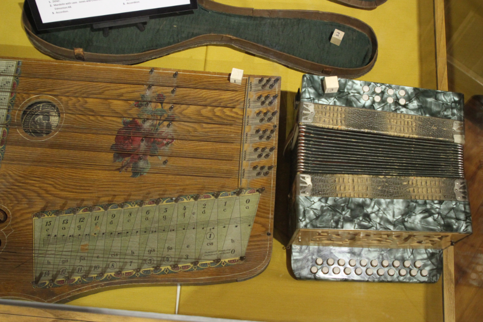 Beautifully decorated zither and accordion in the Creighton House Museum in Yale, BC