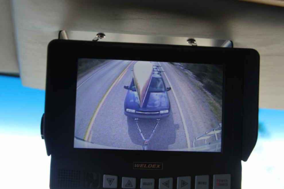 Toad and canoe behind the RV, as seen by the backup camera