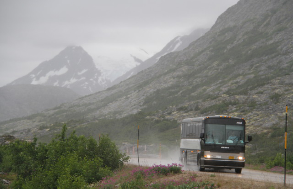 A tour bus in the rain in the White Pass