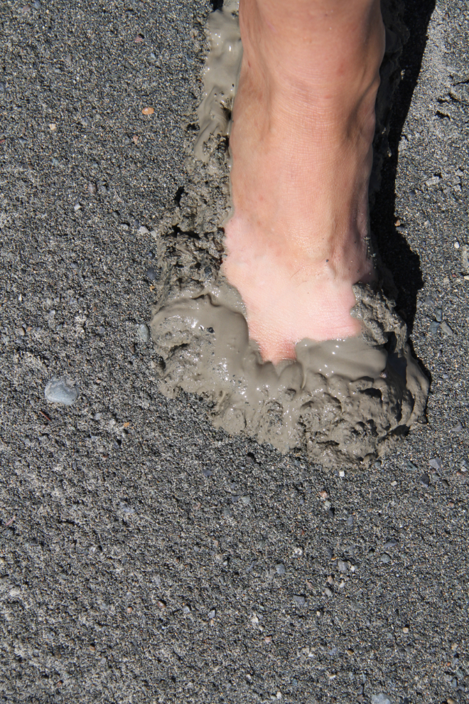 Barefoot in deep mud at Congdon Creek, Yukon