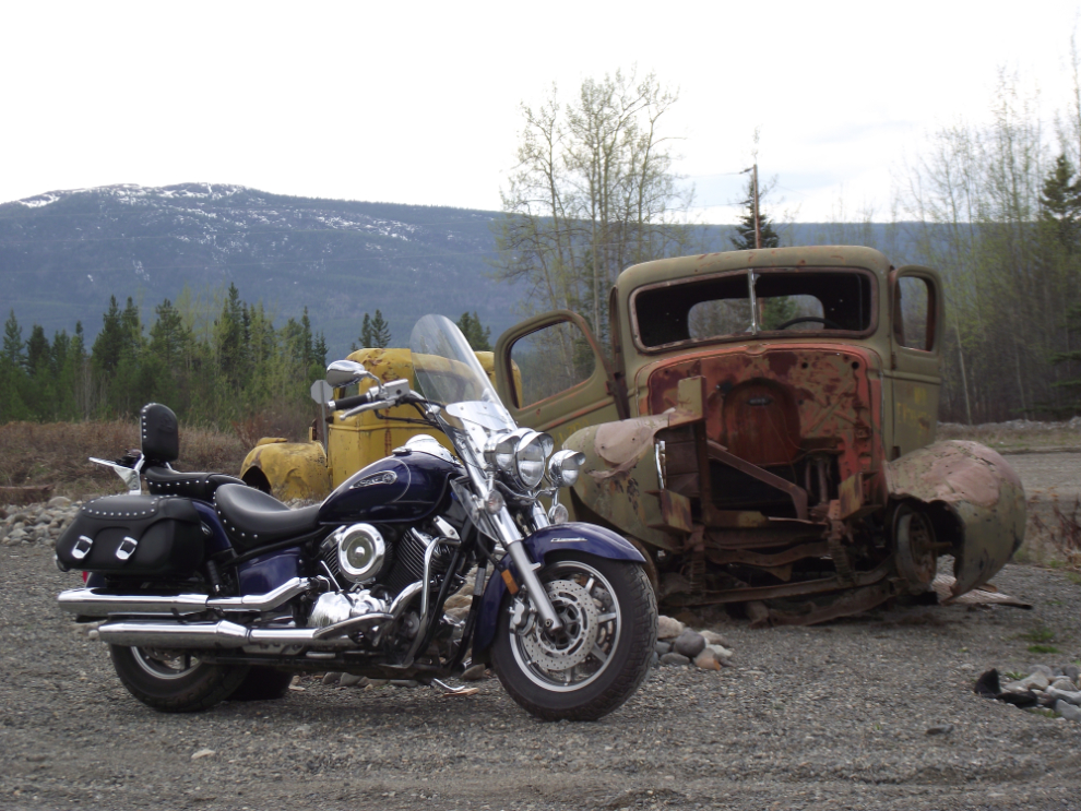 My V-Star motorcycle with an old truck at the South Canol Road rest area