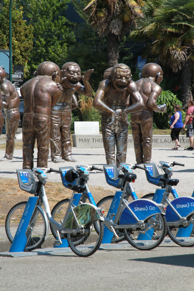 'A-maze-ing Laughter' is a 2009 bronze sculpture by Yue Minjun, located in Morton Park on Beach Avenue.