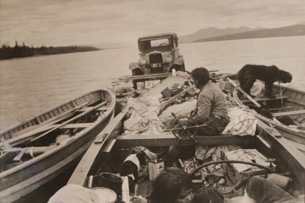 A photo of George Johnston's 1928 Chevrolet on a raft of boats, at the George Johnston Museum in Teslin, Yukon