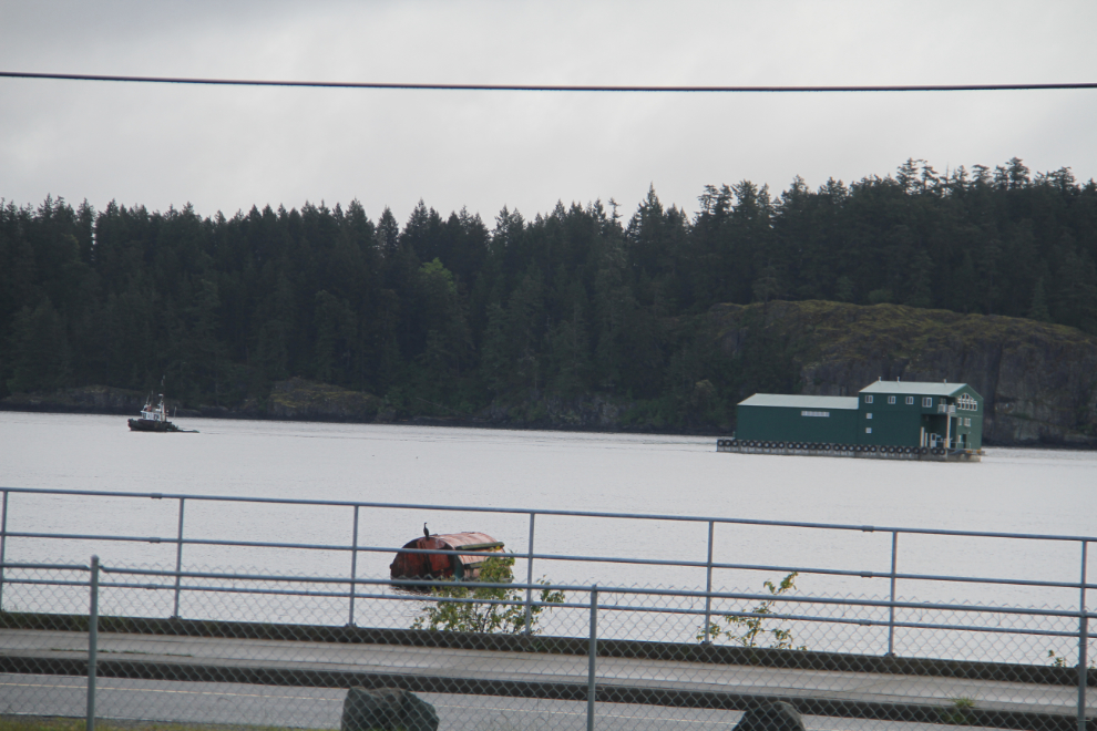 Tug towing a camp barge past Campbell River
