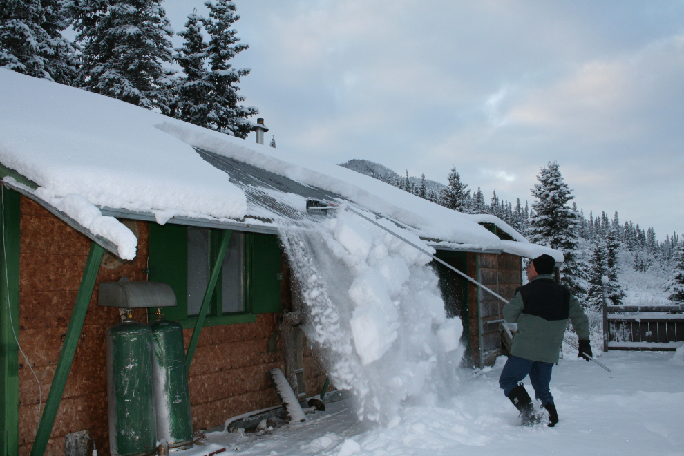 A roof rake makes clearing snow off a metal roof easy - fun even!