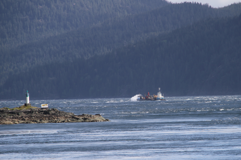 Freight boat going through Seymour Narrows, BC