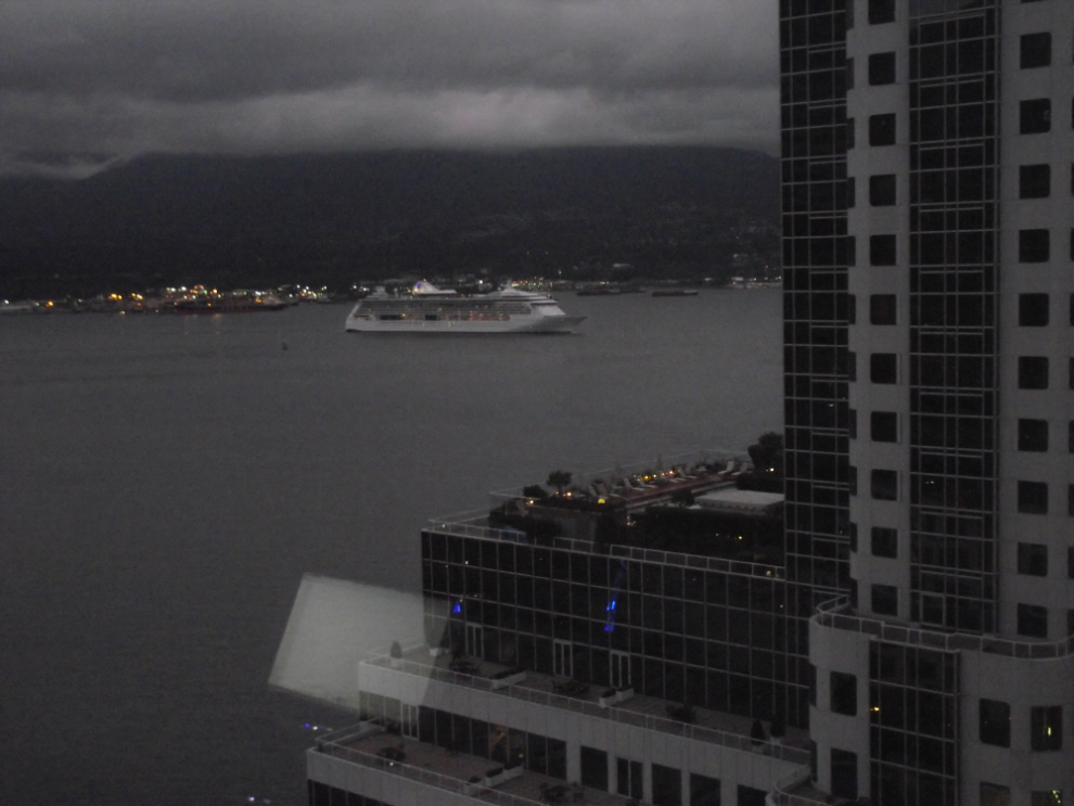 Radiance of the Seas sailing into Vancouver on a very dark morning harbour