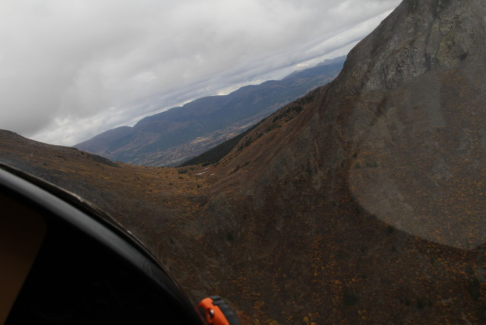Flying through a notch in Gray Ridge, north of Carcross, Yukon